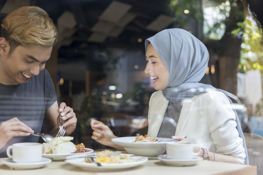 Muslim couple in the restaurant